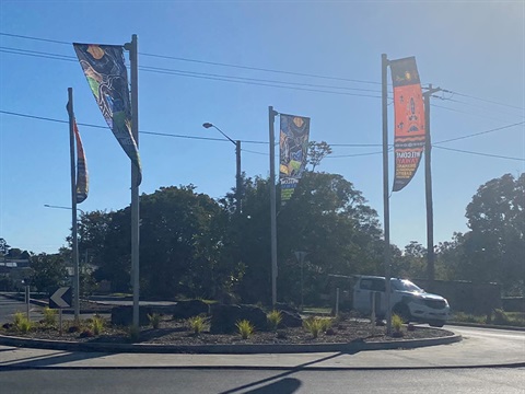 The welcome flags at the Middleton & Lachlan Street roundabout in South Kempsey