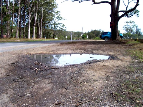 Pothole on the side of a road in Kempsey Shire