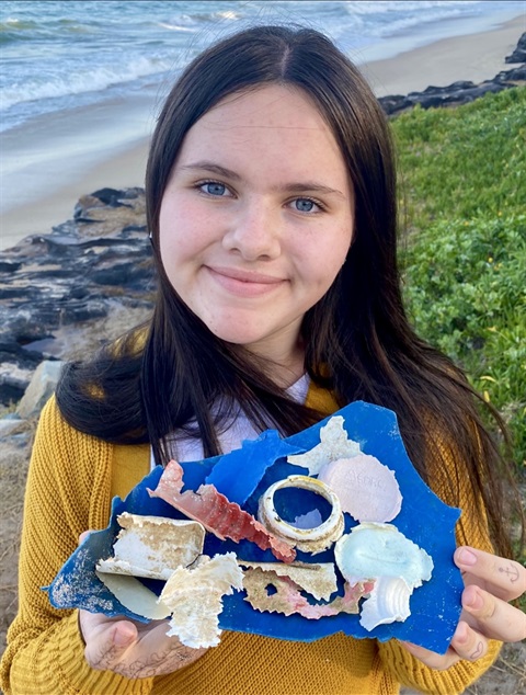 Shalise Leesfield pictured with plastics found near the ocean